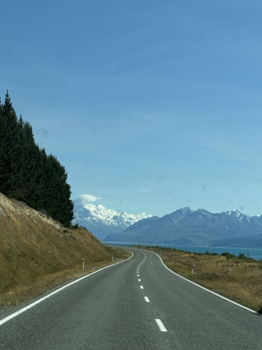 The road to Aoraki/Mount Cook along Lake Pukaki, with the mountain in the distance